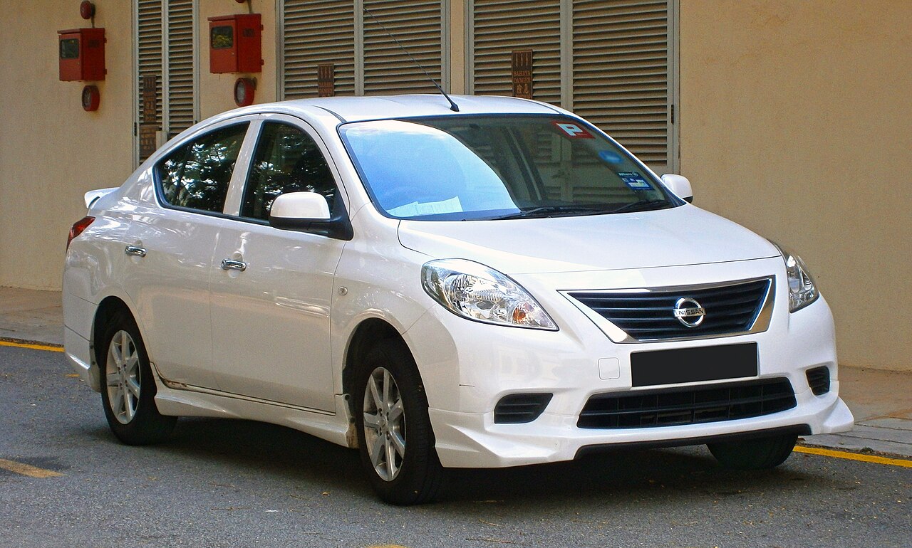 Nissan Almera, a four-door saloon, photographed from the front three-quarter angle