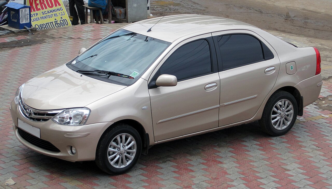 Toyota Etios, a four-door saloon, photographed from the front three-quarter angle