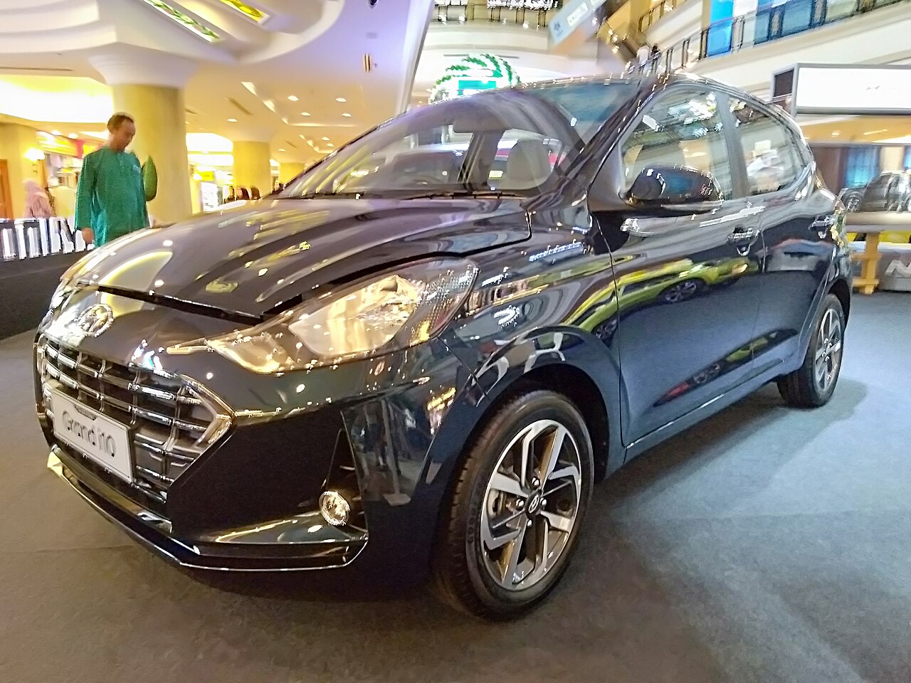 Hyundai Grand i10, a small five-door hatchback, photographed from the front three-quarter angle