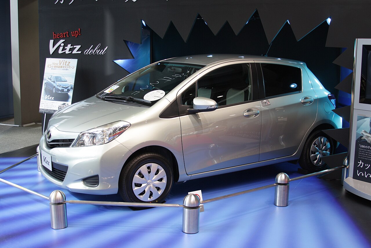 Toyota Vitz, a compact five-door hatchback, photographed from the front three-quarter angle